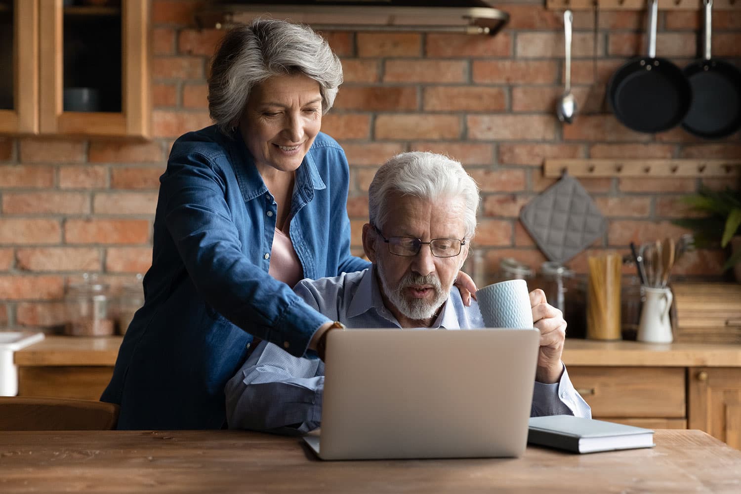 older couple working on laptop